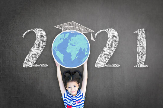 2021 new educational academic calendar year for school class with student kid raising world global planet on teacher's black chalkboard for back to school celebration, classroom schedule concept. - Powered by Adobe