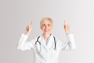 Prevention health protection and recommendations of doctors. Happy adult female doctor shows thumbs up