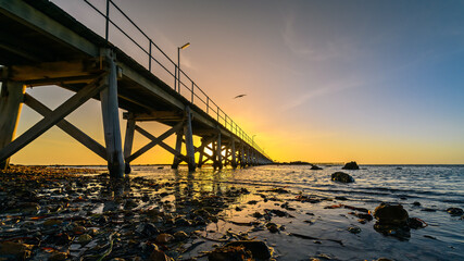 Fototapeta premium Moonta Bay foreshore with jetty at sunset, Yorke Peninsula, South Australia