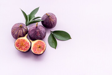 Fresh figs with green leaf. Mediterranean fruit background