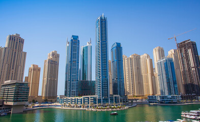 Fototapeta na wymiar Dubai Marina city with skyscrapers and boats, United Arab Emirates