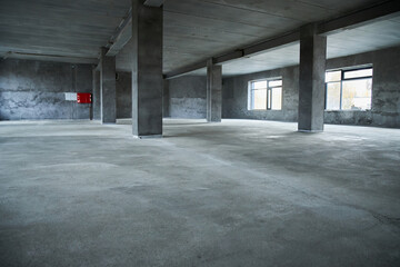 Filling the floor with concrete, screed and leveling the floor. Smooth floors made of a mixture of...