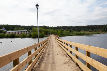 wooden newly built pedestrian bridge over the Sysert river