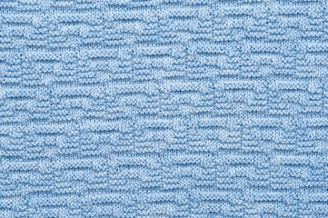 Close-up fragment of warm knitted blue sweatshirts. Concept of warm everyday things. clothing store concept. Advertising space. Place for text