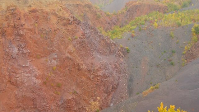 Failed quarry iron ore mine, mine construction. Industrial mining conveyor red iron ore Krivoy Rog Ukraine.