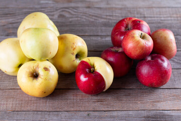 Ugly fruits concept. Organic apples on wooden background. The concept of ecology, not plastic. Healthy food.