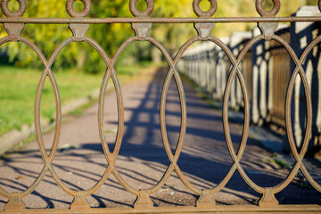 beautiful wrought iron lattice in the park in autumn