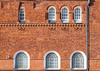 Fototapeta na wymiar Red brick facade old believers religious building front view