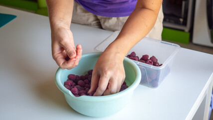 sort the red raspberries by hand