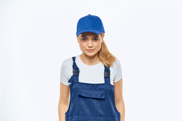 Woman in working uniform blue cap delivery courier delivery service