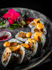 sushi roll with eel and rice in plate