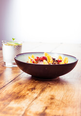 Water with lemon and porridge, oatmeal with fresh fruit
