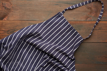 blue textile kitchen apron with white stripes