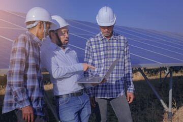 Electrical, instrument technician and worker discuss after working for maintenance electrical system at solar panel field	