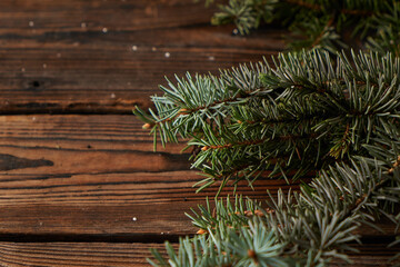 New Year's wood background with spruce branches. Christmas concept