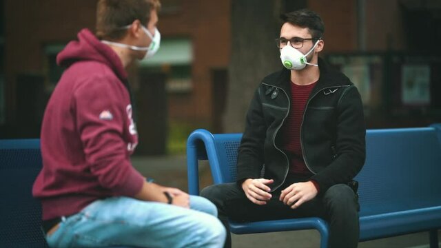 Young Adults wearing an anti virus protection mask ffp2 standart to prevent corona COVID-19 and SARS infection