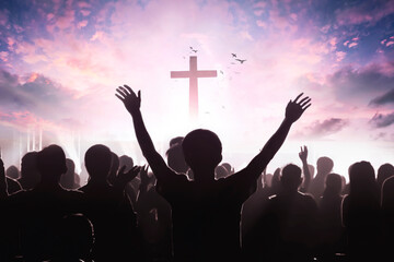christian people group raise hands up worship God Jesus Christ together on cross over cloudy sky background