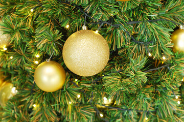 Fototapeta na wymiar Christmas-tree with golden ball decorations