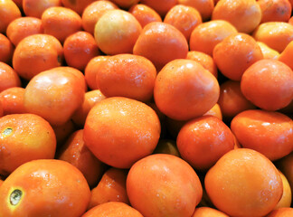 top view of many tomatoes on the table at supermarket.