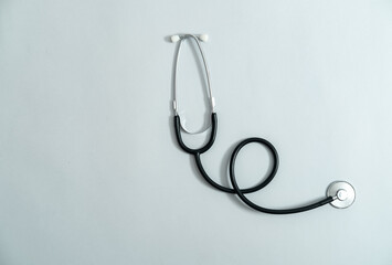 Fototapeta na wymiar Stethoscope on gray background stock photo