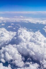 Fototapeta premium Sky cloudscape.Blue sky and white clouds on a sunny day.Aerial view.