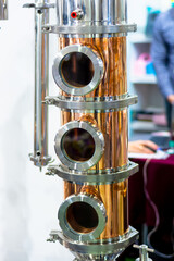 Shiny stainless steel and copper pipes. Apparatus for making vodka at home