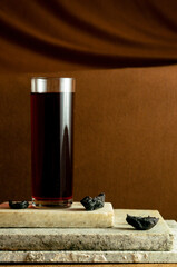 Healthy kokum fruit juice with dry kokum fruit beside