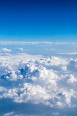 Naklejka premium Sky cloudscape.Blue sky and white clouds on a sunny day.Aerial view.