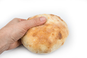 Traditional home bake bread lepinja on a white