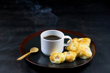 Coffee Cup and Bread Roll. Continental Breakfast.