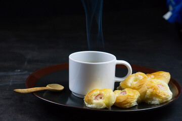 Coffee Cup and Bread Roll. Continental Breakfast.
