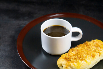 Coffee Cup and Bread Roll. Continental Breakfast.
