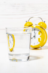 morning glass of pure water, conceptual photo, vertical closeup