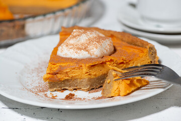 piece of sweet pumpkin pie with cream