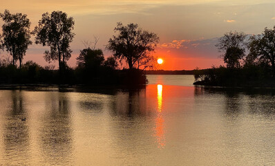 Fototapeta premium sunset over lake lagoon