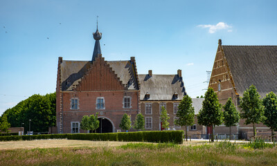 Fototapeta na wymiar Gatehouse of Herkenrode Abbey, a large monastery of Cistercian nuns located in Kuringen, Hasselt, Limburg, Belgium