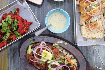 Various South Asian dishes including meat 