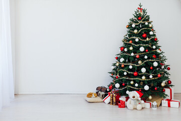 Christmas tree pine interior of the house new year decoration garland gifts