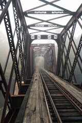 Abandoned train bridge with fog in the back, Pemi River, New Hampshire