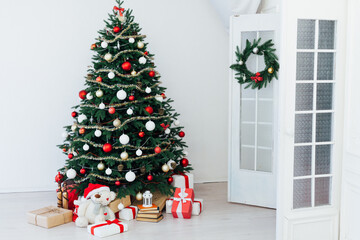 Christmas tree pine interior of the house new year decoration garland gifts