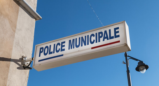 Police Municipale (municipal police) sign on the storefront of a local police station