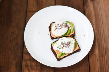 Healthy sandwiches with poached eggs. Soft selective focus