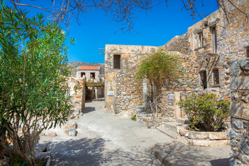 Naklejka premium View of the island of Spinalonga with calm sea. Here were isolated lepers, humans with the Hansen's desease, gulf of Elounda, Crete, Greece. 