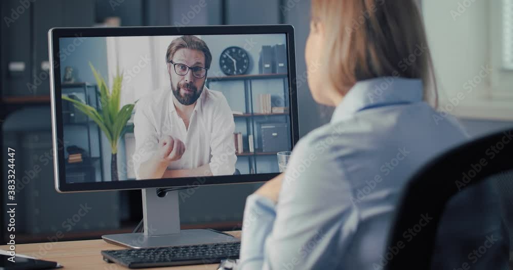 Poster two business colleagues sitting at own office and having working discussion via video call on comput