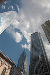 Fototapeta na wymiar Bottom up view of Philadelphia skyscraper and reflection in glass in downtown Philadelphia Pennsylvania, USA 