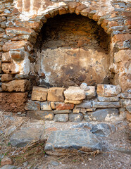 View of the island of Spinalonga with calm sea. Here were isolated lepers, humans with the Hansen's desease, gulf of Elounda, Crete, Greece. 