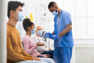 Nurse Working Talking With Patients In Hospital During Covid-19 Vaccination