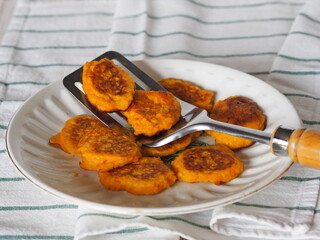 Pumpkin and millet pancakes. Russian national cuisine, healthy breakfasts. Popular in kindergartens, good for toddlers and older people.Authentic Russian still life