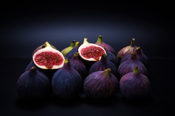 Tasty figs on a black background. Top view.
