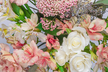Bouquet of  soft pink flowers in wrapping paper.